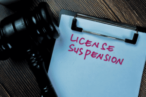 Gavel next to clipboard reading “License Suspension” — representing ARS 28-3473 driving offense in Arizona