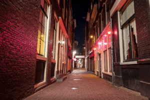 Red-light district alley with brothel windows at night – brothels are illegal in Arizona