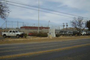 CoreCivic Eden Detention Center exterior view with security fencing and parking lot