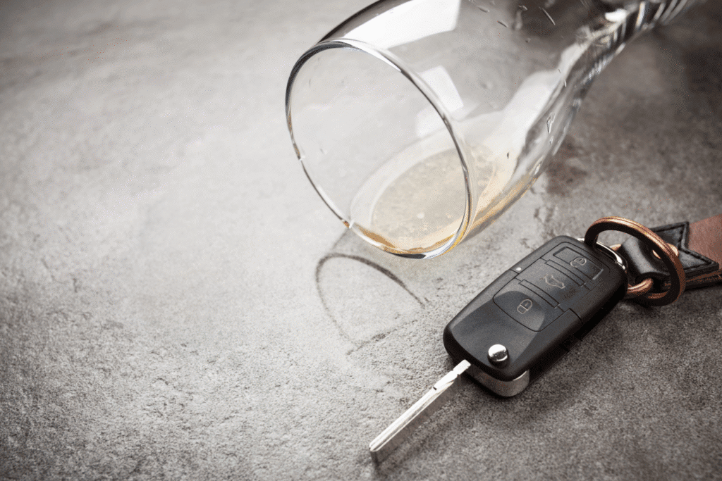 Empty wine glass and car key symbolizing DUI arrest in Scottsdale, Arizona