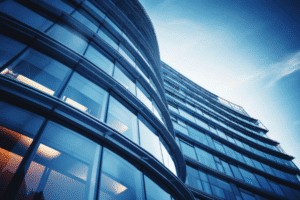 Modern glass high-rise office building representing Big Law firms compared to Arizona regional law firms