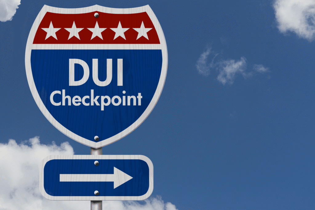 DUI checkpoint sign under blue sky in Arizona