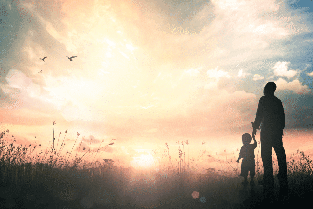 Father and child holding hands at sunset – Arizona fathers’ rights advocacy