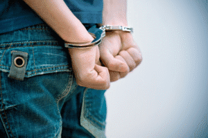 Juvenile defense attorney representing handcuffed teen in Arizona