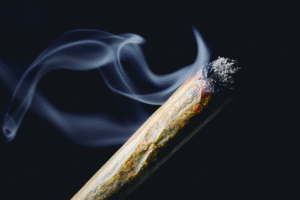 Burning marijuana joint emitting smoke — marijuana DUI laws in Arizona