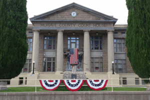 Mohave County Courthouse in Kingman Arizona with American flag and patriotic bunting – Rideout Law Group serves clients here in criminal and family law cases.