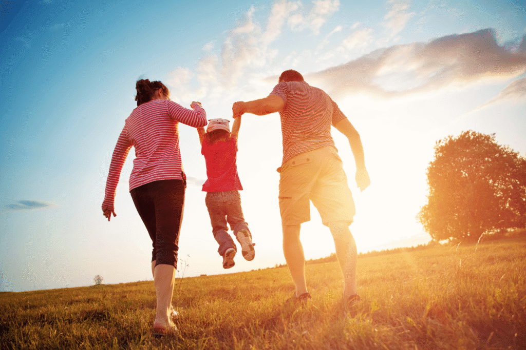 Parents modifying parenting time agreement in Arizona with child at sunset
