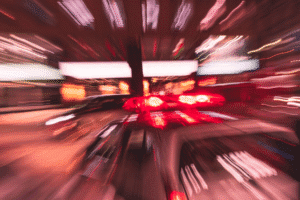 Police lights and traffic blur after a reckless driving accident in Arizona