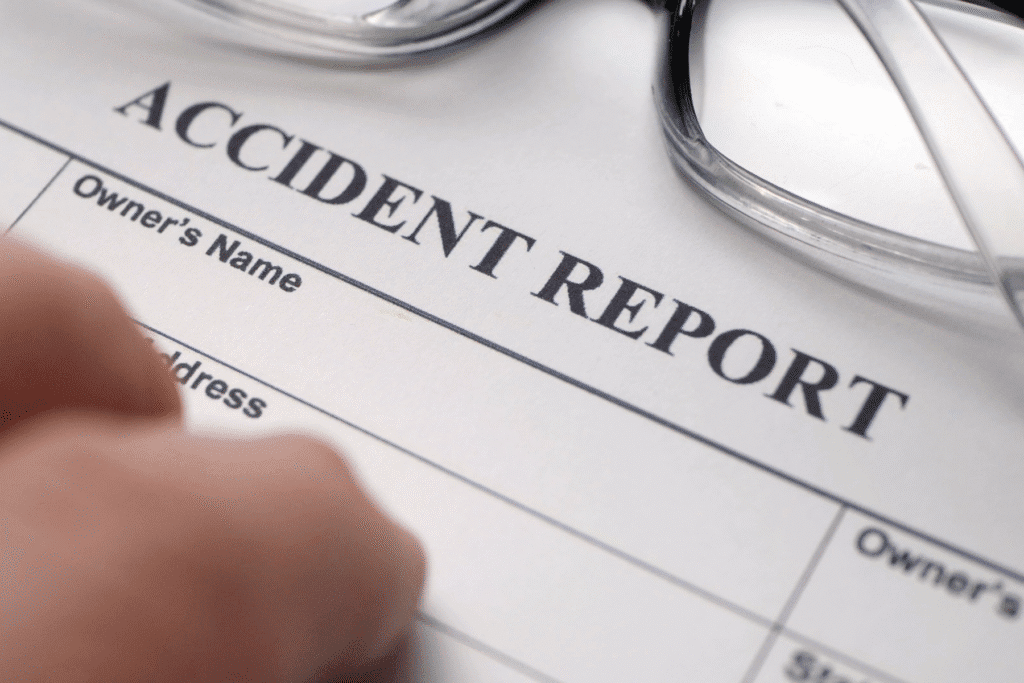 Accident report form with glasses – filing an accident claim in Scottsdale