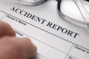 Accident report form with glasses – filing an accident claim in Scottsdale