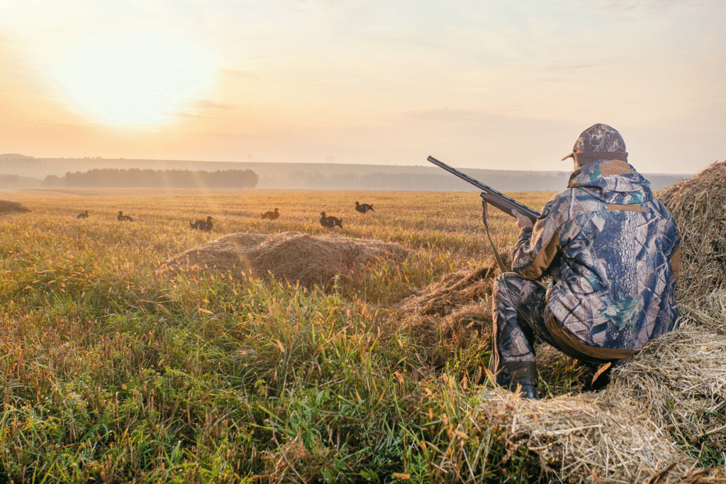 Hunter in Arizona field at sunrise | Hunting accident attorney context