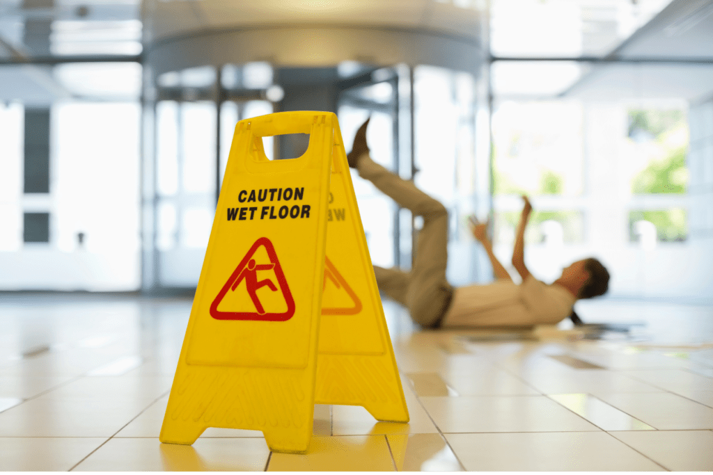 Slip and Fall Accident in Scottsdale with Wet Floor Warning Sign in Commercial Building