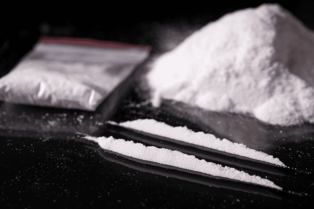 Cocaine drug lines and powder on black surface Scottsdale Arizona criminal defense context